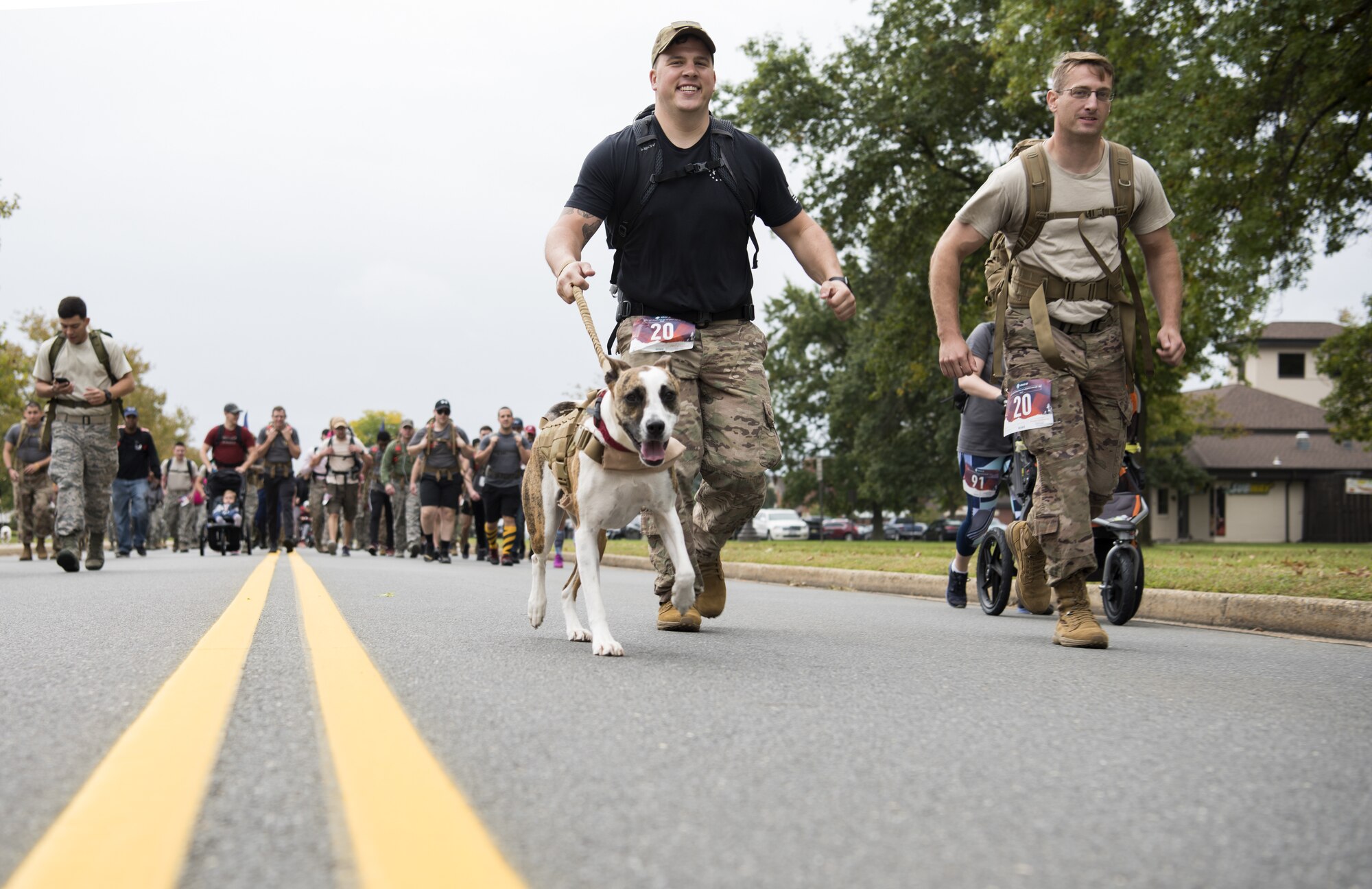 Joint Base McGuire-Dix-Lakehurst community members ruck during the 12th Annual Gold Star Ruck March on Joint Base MDL, New Jersey, Oct. 6, 2018. Gold Star Families for Peace was founded in 2005 by those who lost family members in the most recent war in Iraq, which gave them the right to display a Gold Star. (U.S. Air Force photo by Airman First Class Ariel Owings)