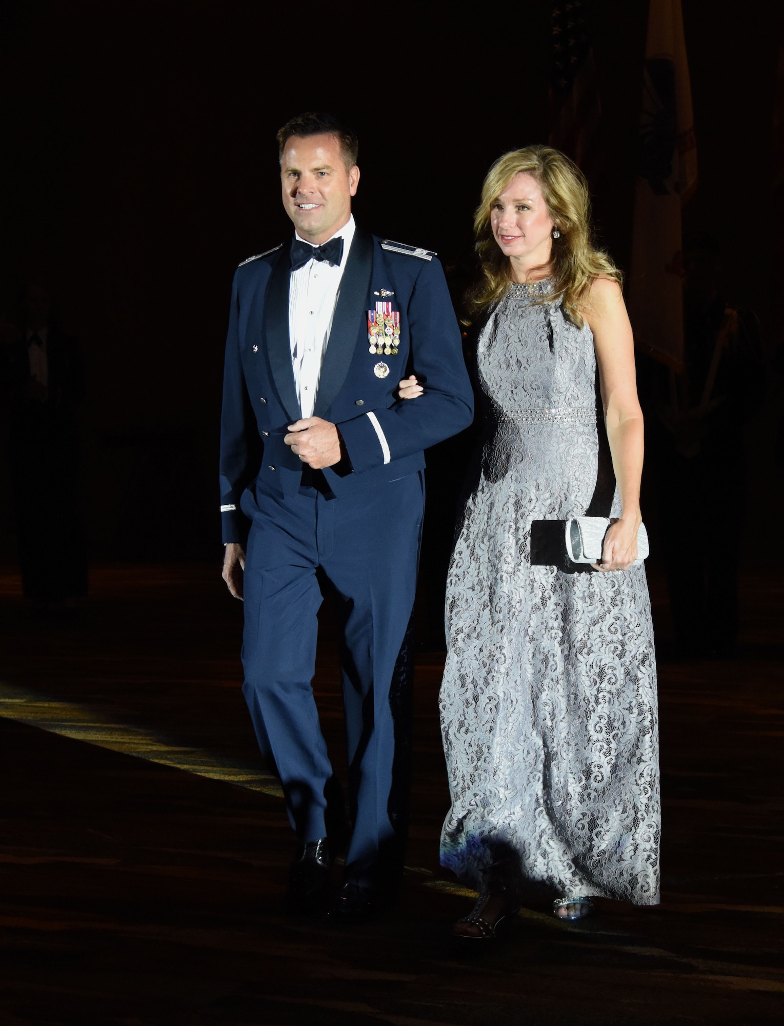 U.S. Air Force Col. Lance Burnett, 81st Training Wing vice commander, and his wife Andrea, make their way to the head table during the 40th Annual Salute to the Military inside the Mississippi Coast Convention Center, in Biloxi, Mississippi, Oct. 16, 2018. The Salute to the Military event recognized the men and women who serve in the military along the Gulf Coast. (U.S. Air Force photo by Kemberly Groue)