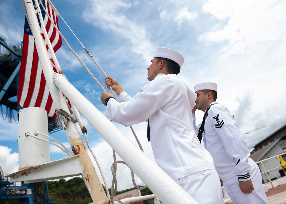 U.S. Navy Sailors shift colors as hospital ship USNS Comfort (T-AH 20) departs Panama City, Panama.