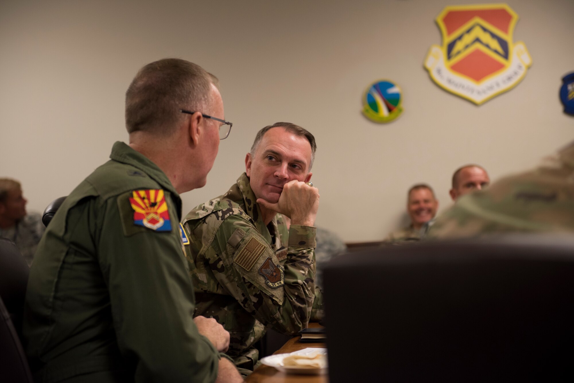 Lt. Gen. Warren D. Berry, deputy chief of staff of the Air Force for Logistics, Engineering and Force Protection, speaks with Brig. Gen. Todd Canterbury, 56th Fighter Wing commander, during a brief on integrated maintenance technician programs for F-35A Lightning II maintenance Oct. 4, 2018, at Luke Air Force Base, Ariz. The program being developed at Luke, the Lightning Integrated Technician team, combines maintainers from multiple disciplines into a single team assigned to a dedicated aircraft. (U.S. Air Force photo by Senior Airman Ridge Shan)