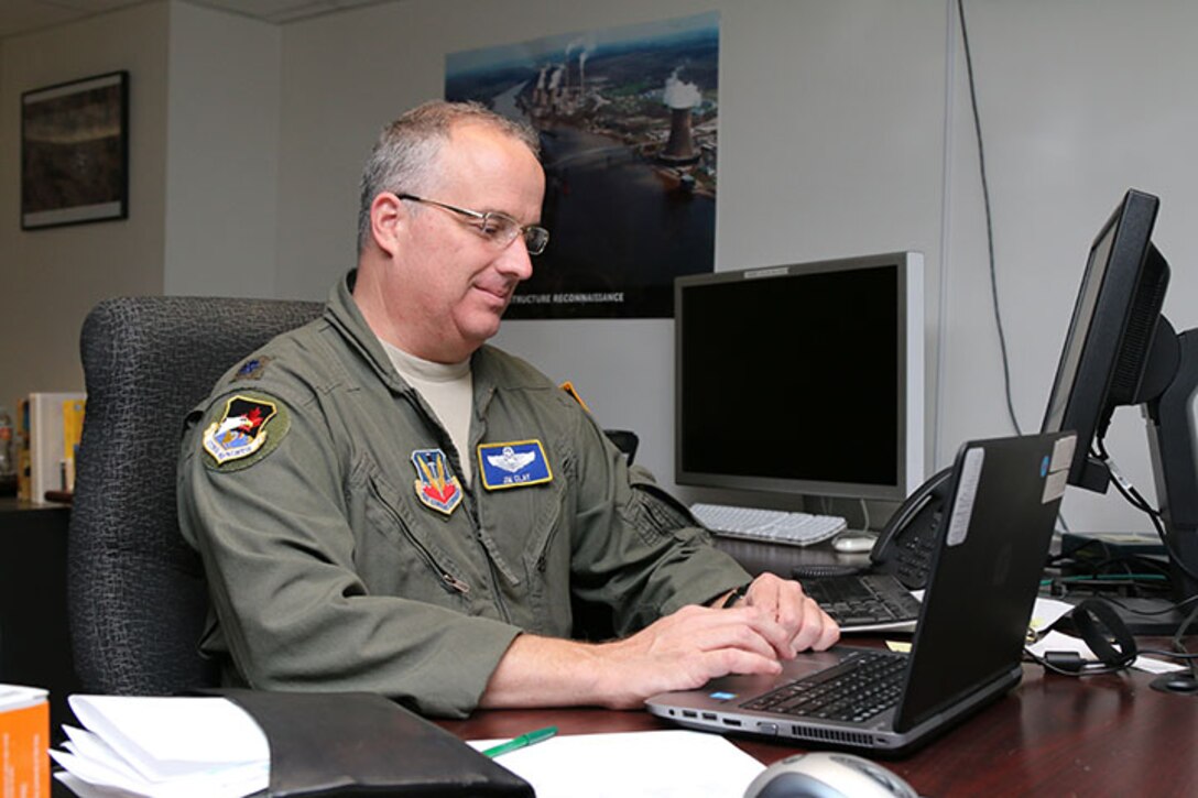 Lt. Col. Jim Clay, 1st Air Force director of Civil Air Patrol operations, is
one of several Hurricane Michael evacuees now working in CAP National
Headquarters at Maxwell Air Force Base, Ala. His temporary office is set up
in CAP's National Operations Center. (Civil Air Patrol photo by Susan
Schneider)