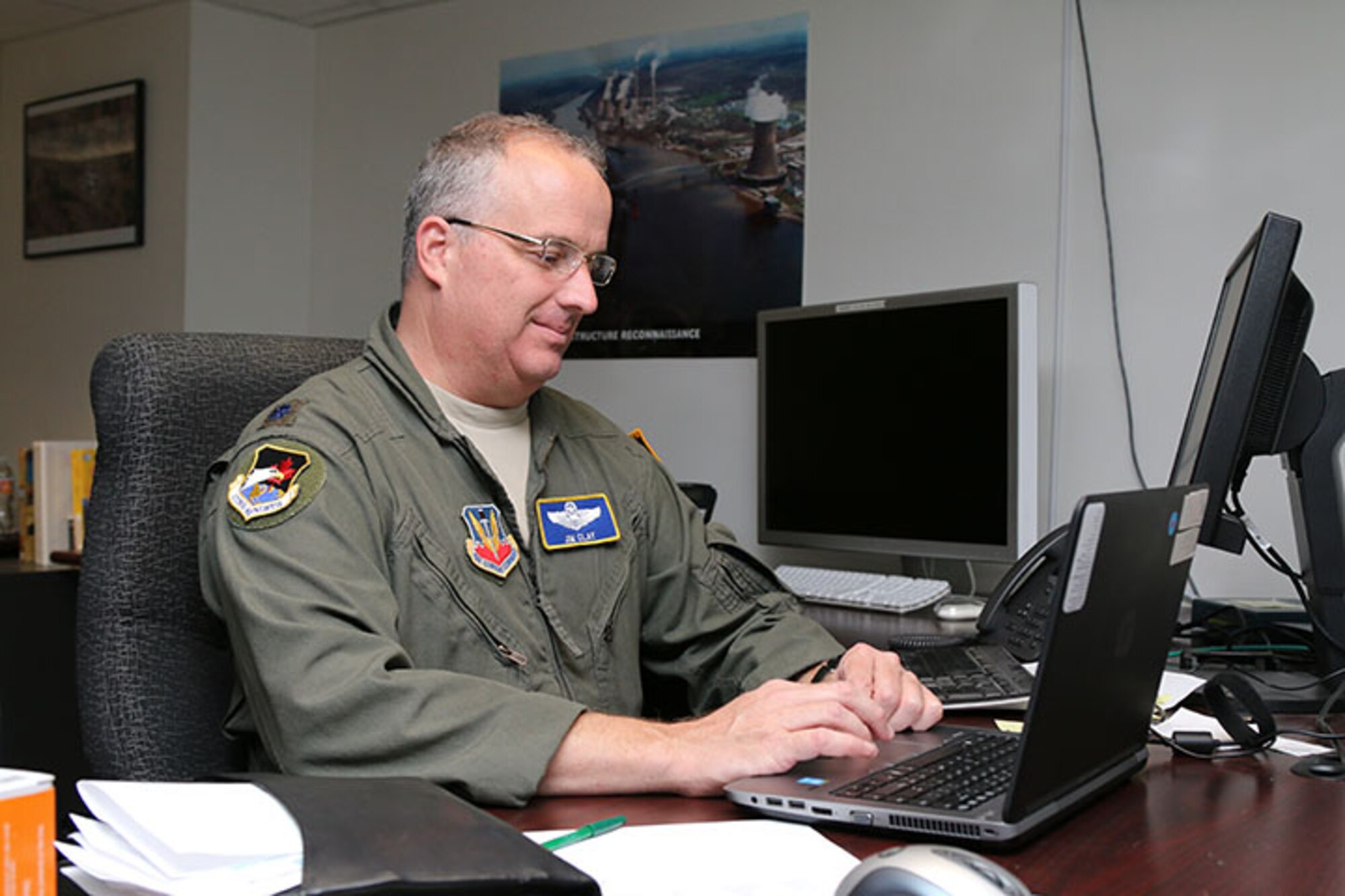 Lt. Col. Jim Clay, 1st Air Force director of Civil Air Patrol operations, is
one of several Hurricane Michael evacuees now working in CAP National
Headquarters at Maxwell Air Force Base, Ala. His temporary office is set up
in CAP's National Operations Center. (Civil Air Patrol photo by Susan
Schneider)