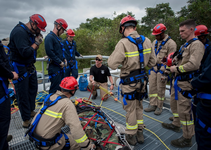 U.S. Air Force Airmen assigned to the 633rd Civil Engineer Squadron Fire Department participate in low-angle rescue training at Joint Base Langley-Eustis, Virginia, Sept. 28, 2018