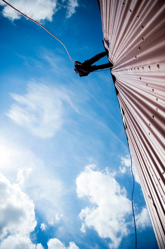 U.S. Air Force Staff Sgt. Colton Peer, 633rd Civil Engineer Squadron lead firefighter, rappels down the side of a building during training at Joint Base Langley-Eustis, Virginia, Oct. 2, 2018.