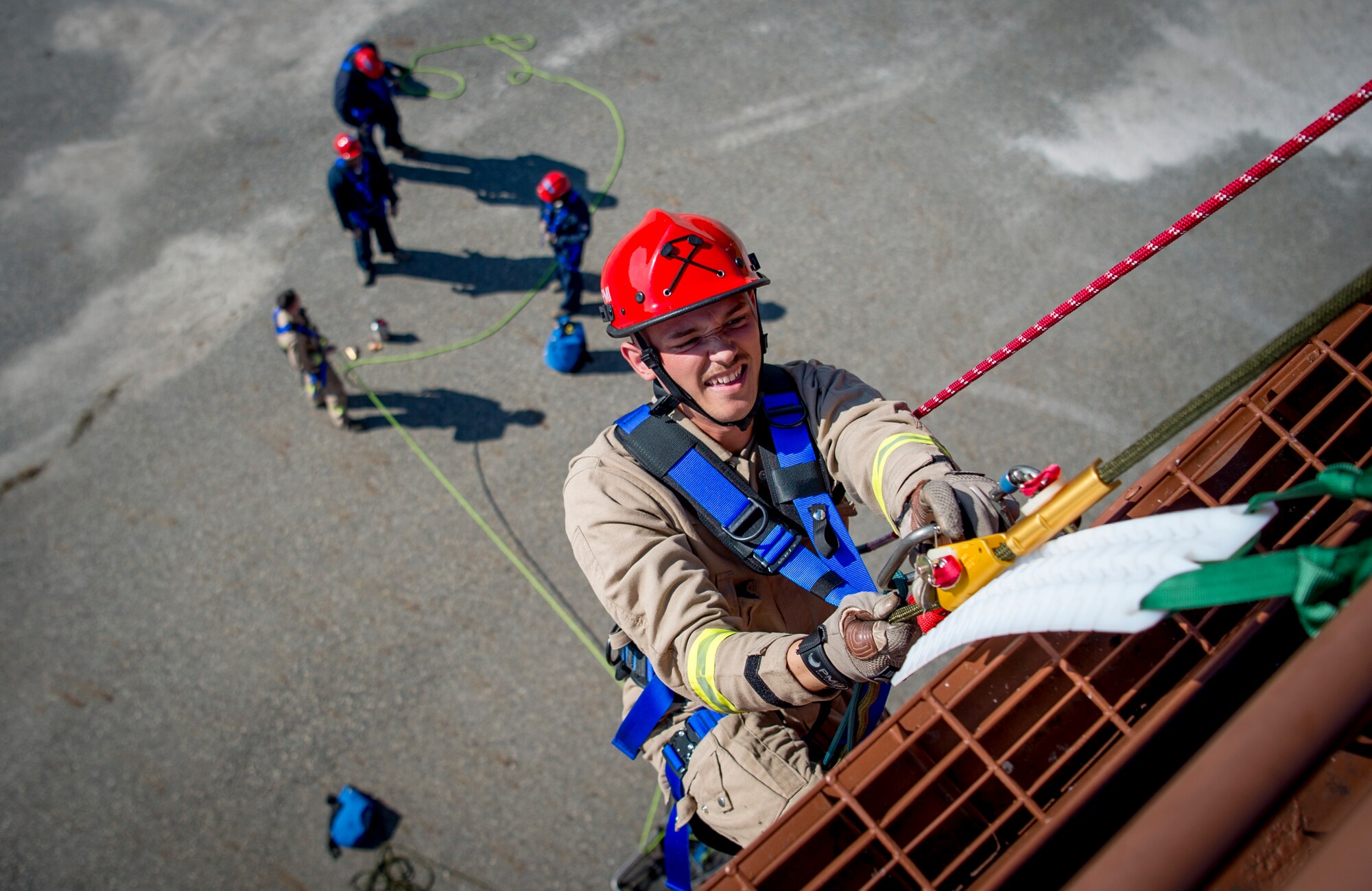 U.S. Air Force Airman 1st Class Josehia Hotz, 633rd Civil Engineer Squadron firefighter, ascends the side of a building during the final evaluation at Joint Base Langley-Eustis, Virginia, Oct.15, 2018.