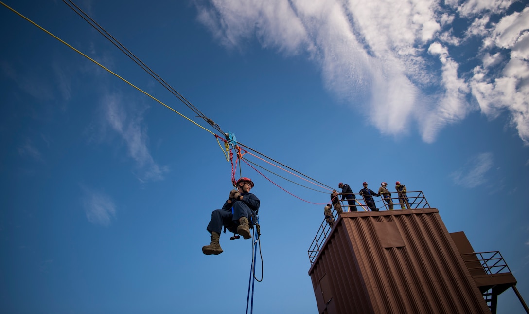 U.S. Air Force Airmen assigned to the 633rd Civil Engineer Squadron Fire Department complete a highline rescue during training at Joint Base Langley-Eustis, Virginia, Oct. 15, 2018.