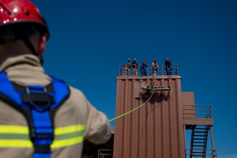 U.S. Air Force Airmen assigned to the 633rd Civil Engineer Squadron Fire Department transport a victim during the final evaluation at Joint Base Langley-Eustis, Virginia, Oct.15, 2018.