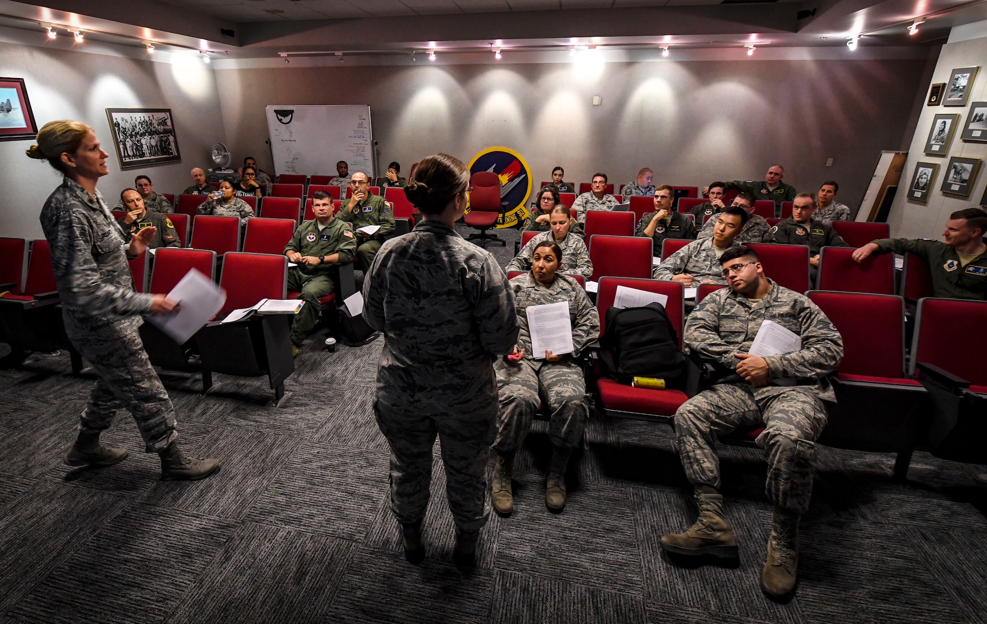 Air Force Safety Center Human Factor Workshop instructors, Maj. Nancy Delaney, left, and Maj. Heather Tevebaugh, brief students during their course at Joint Base Langley-Eustis, Virginia, Oct. 10, 2018. In this iteration of the course, the entire class of students and the instructors all came from the aerospace and operational physiology career field and are used as subject-matter experts during accident investigation boards. During this course students learned about how human factors are involved in occupational safety and accident investigation boards. (U.S. Air Force photo by Tech. Sgt. Nick Wilson)