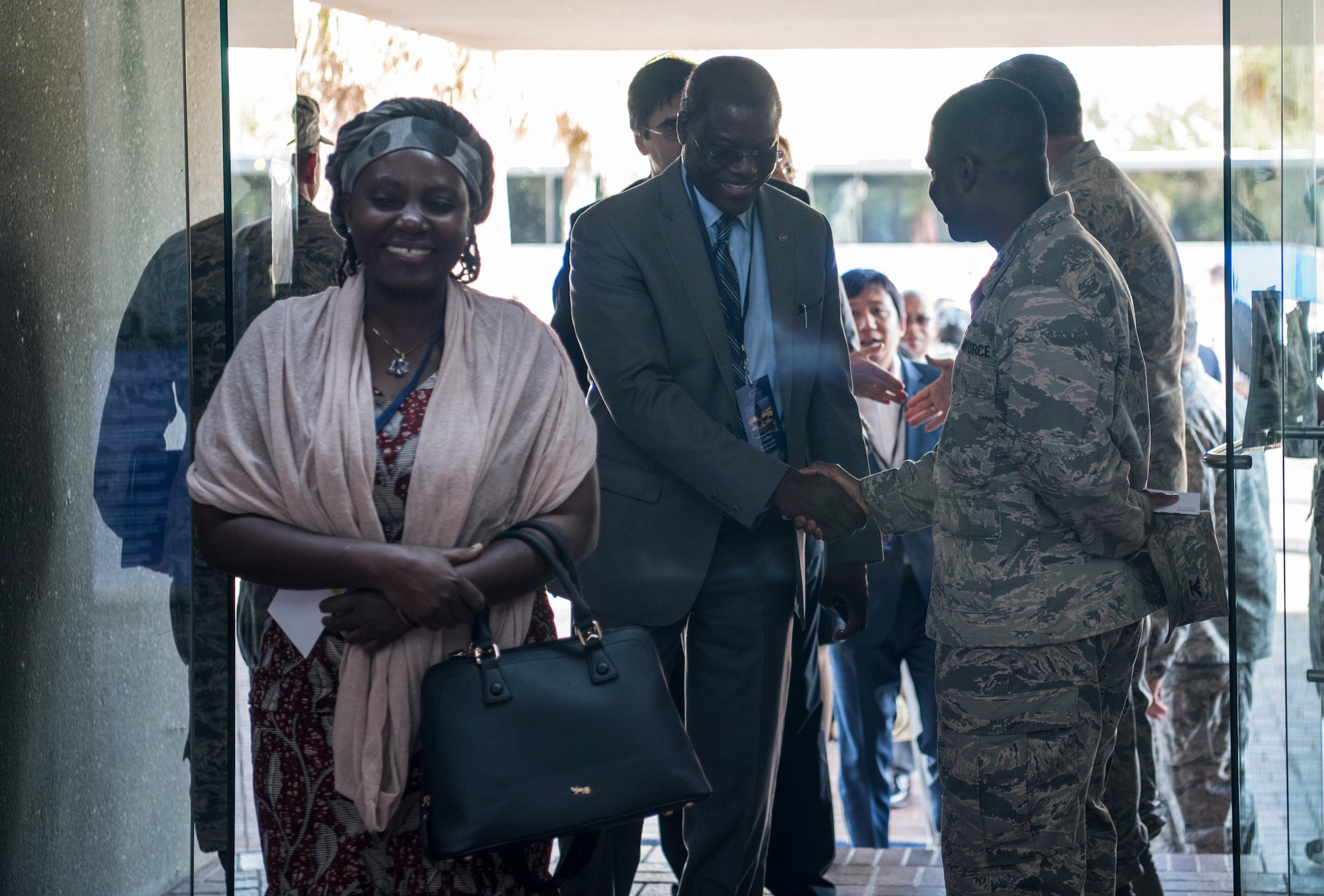 U.S. Air Force Col. Terrence Adams, right, greets the foreign ambassadors and spouses walking into the wing headquarters building Oct. 15, 2018, at Joint Base Charleston, S.C. Hosting the ambassadors allowed JB Charleston to showcase its warfighting capabilities and assets, while also building relations with key representatives from around the globe.