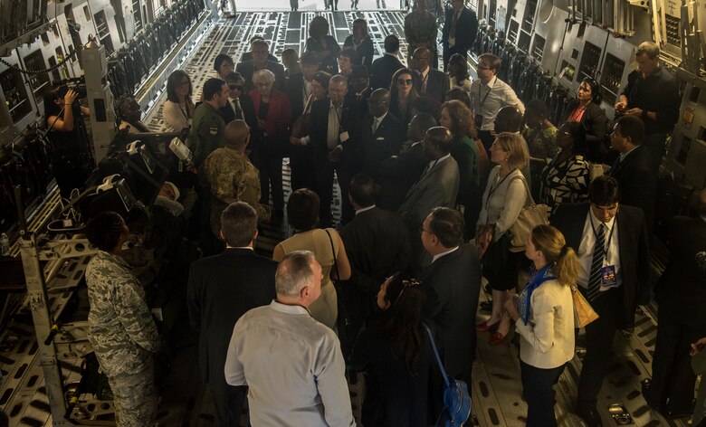 Foreign ambassadors tour a C-17 Globemaster III during their Experience America trip Oct. 15, 2018, at Joint Base Charleston. The diplomatic corps arrived at JB Charleston for a mission briefing, a tour of a C-17 Globemaster III, a tour of the Transportation Isolation System and a visit with explosive ordnance disposal Airmen who gave a robot demonstration. Hosting the ambassadors allowed JB Charleston to showcase its warfighting capabilities and assets, while also building relations with key representatives from around the globe.