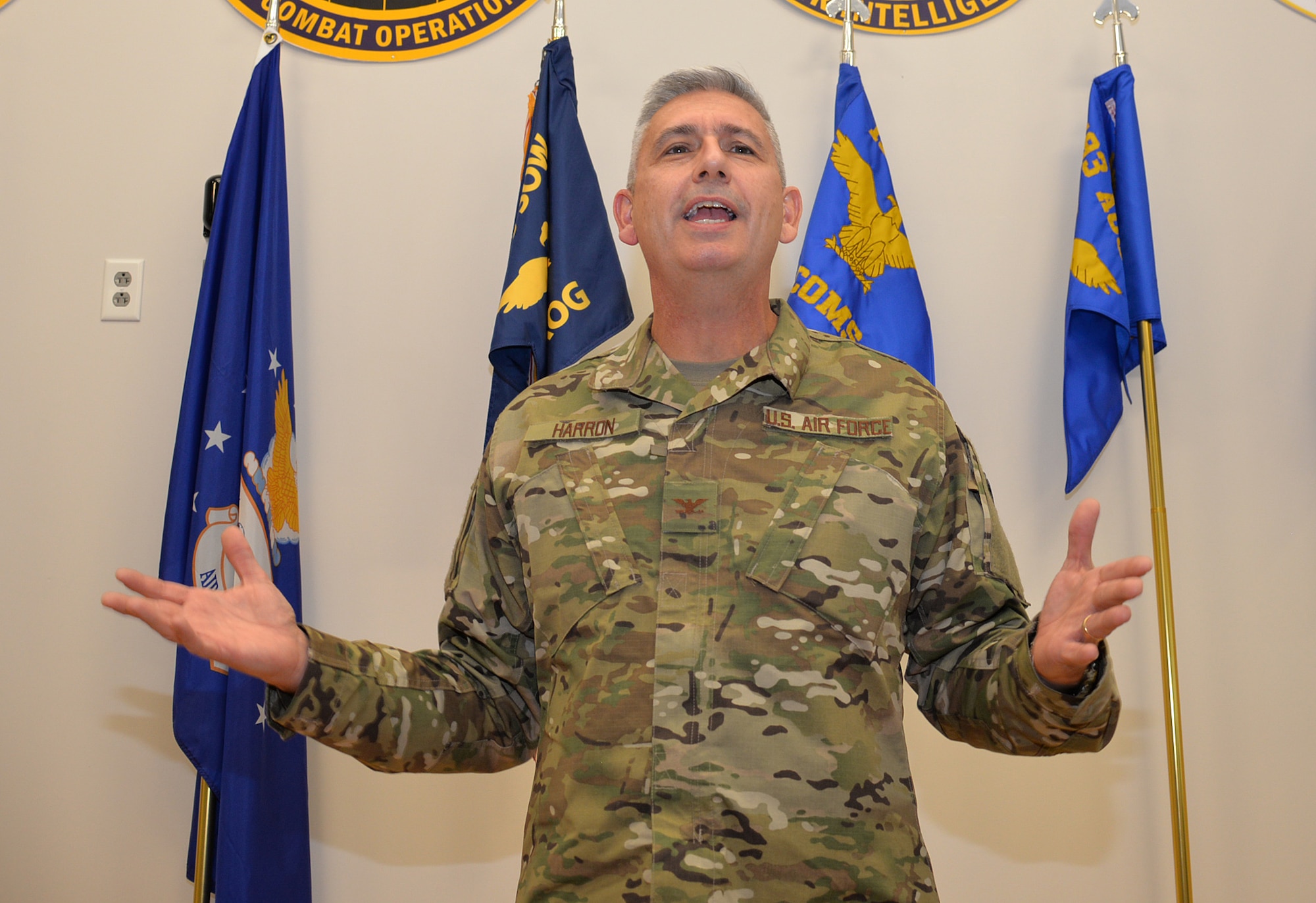 Col. Scott Harron, 193rd Air Operations Group commander, speaks to an audience at the AOG in State College, Pa., during his assumption of command ceremony Oct. 18, 2018. Before taking on the role as AOG commander, Harron served as the 25th Air Force Inspector General, and as Inspection Team Chief at Air Combat Command headquarters. He also served as commander of the 152nd Air Intelligence Squadron at Hancock Field Air National Guard Base, Mattydale, N.Y. Harron spent 16 years as an enlisted troop before commissioning as an Air Force intelligence officer in September 2000. (U.S. Air National Guard photo by 1st Lt. Susan Penning/Released)
