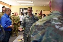Col. Peter Bonetti, 341st Missile Wing vice commander, talks to and thanks the designers and planners, and other special guests, in the new Defenders Den, Oct. 17, 2018, at Malmstrom Air Force Base, Mont. The building increases the footprint of the 341st Security Forces Group on the base and houses a new heritage center and training simulator and can be used for training, meetings and special events. (U.S. Air Force photo by Kiersten McCutchan)