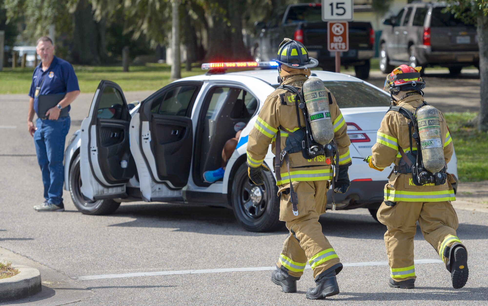 Keesler firefighters prepare to assess the area during the Anti-Terrorism, Force Protection Condition and Chemical, Biological, Radiological, Nuclear and high-yield Explosives training exercise at the Marina at Keesler Air Force Base, Mississippi, Oct. 17, 2018. The AT/FPCON/CBRNE exercise was conducted to evaluate the mission readiness and security of Keesler. (U.S. Air Force photo by Andre' Askew)