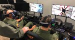 Lt. Col. Derek McCafferty (left) and Maj. Erik Jones, 99th Flying Training Squadron instructor pilots, prepare for a virtual flying training sortie Oct. 9, 2018, at Joint Base San Antonio-Randolph, Texas.  The 99th FTS, along with the 560th FTS, have integrated virtual reality simulators into the  pilot instructor training syllabus as part of an overall strategic effort to leverage emerging technology across the training enterprise.