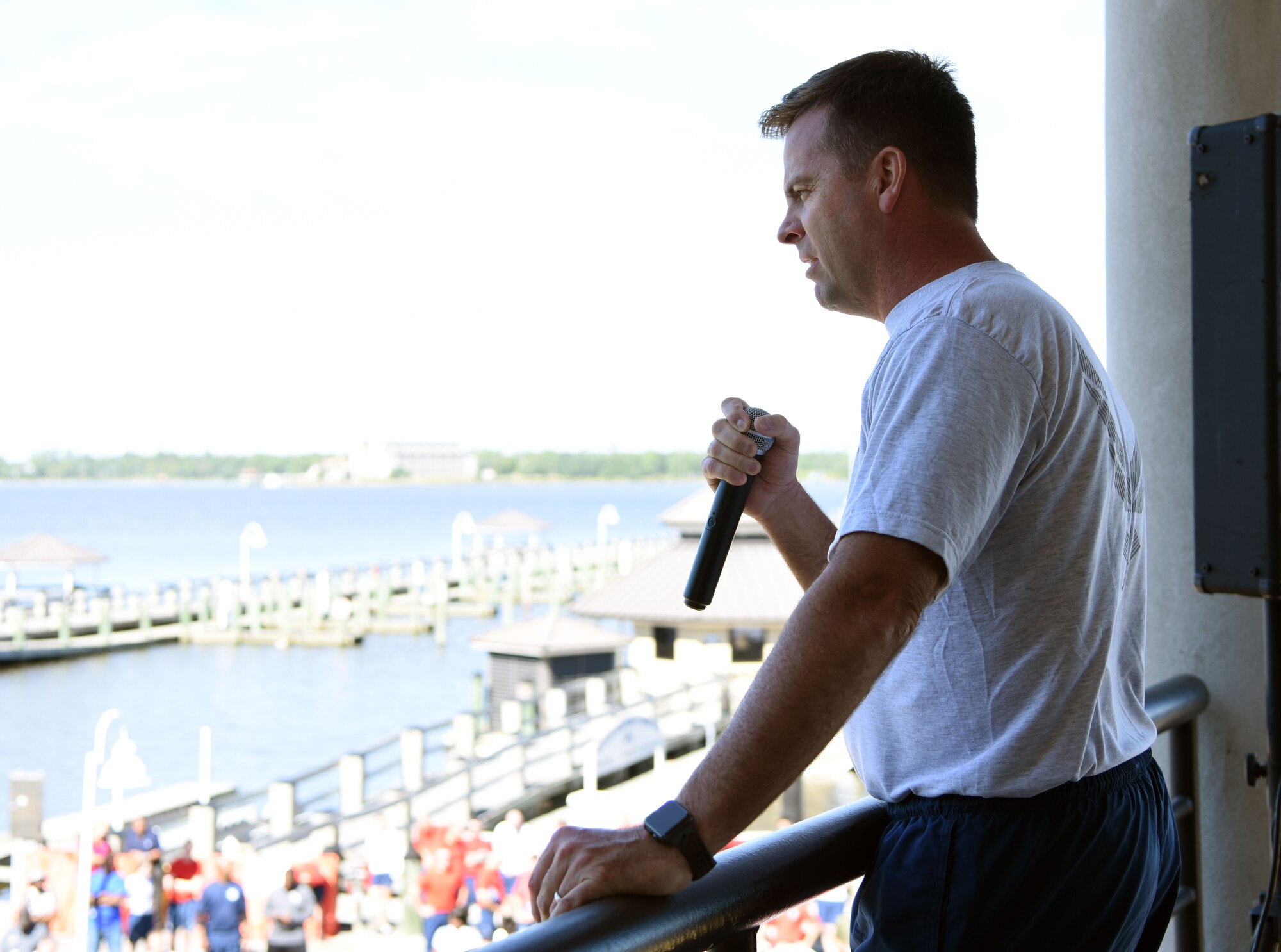 U.S. Air Force Col. Lance Burnett, 81st Training Wing vice commander, delivers remarks to Keesler personnel during Wingman Day at the Marina on Keesler Air Force Base, Mississippi, Oct. 18, 2018. Wingman Day focused on the physical domain, resiliency and team-building initiatives across the base followed by a barbeque and games. (U.S. Air Force photo by Kemberly Groue)