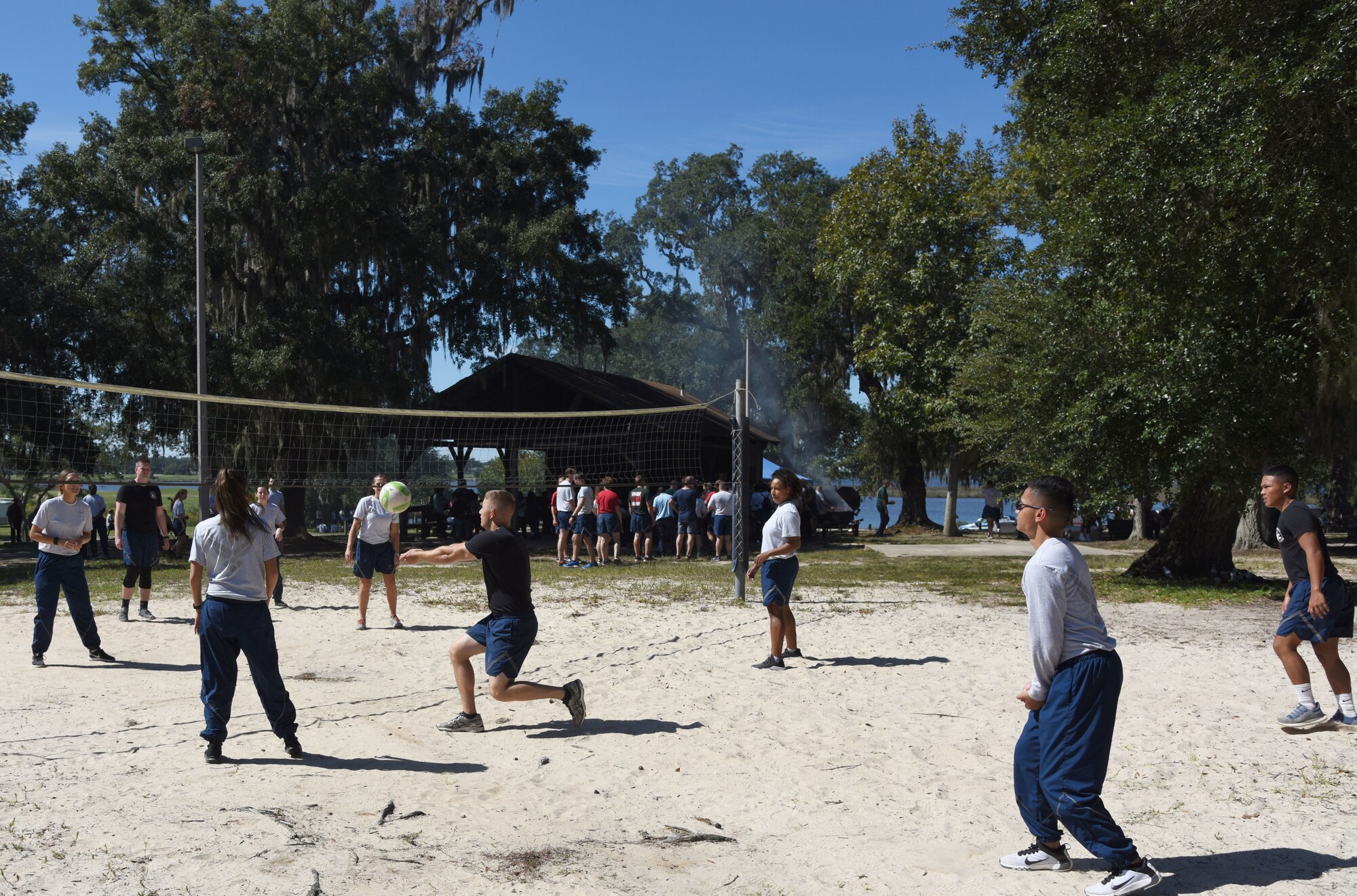 Keesler Airmen participate in a game of volleyball during Wingman Day at the Marina on Keesler Air Force Base, Mississippi, Oct. 18, 2018. Wingman Day focused on the physical domain, resiliency and team-building initiatives across the base followed by a barbeque and games. (U.S. Air Force photo by Kemberly Groue)
