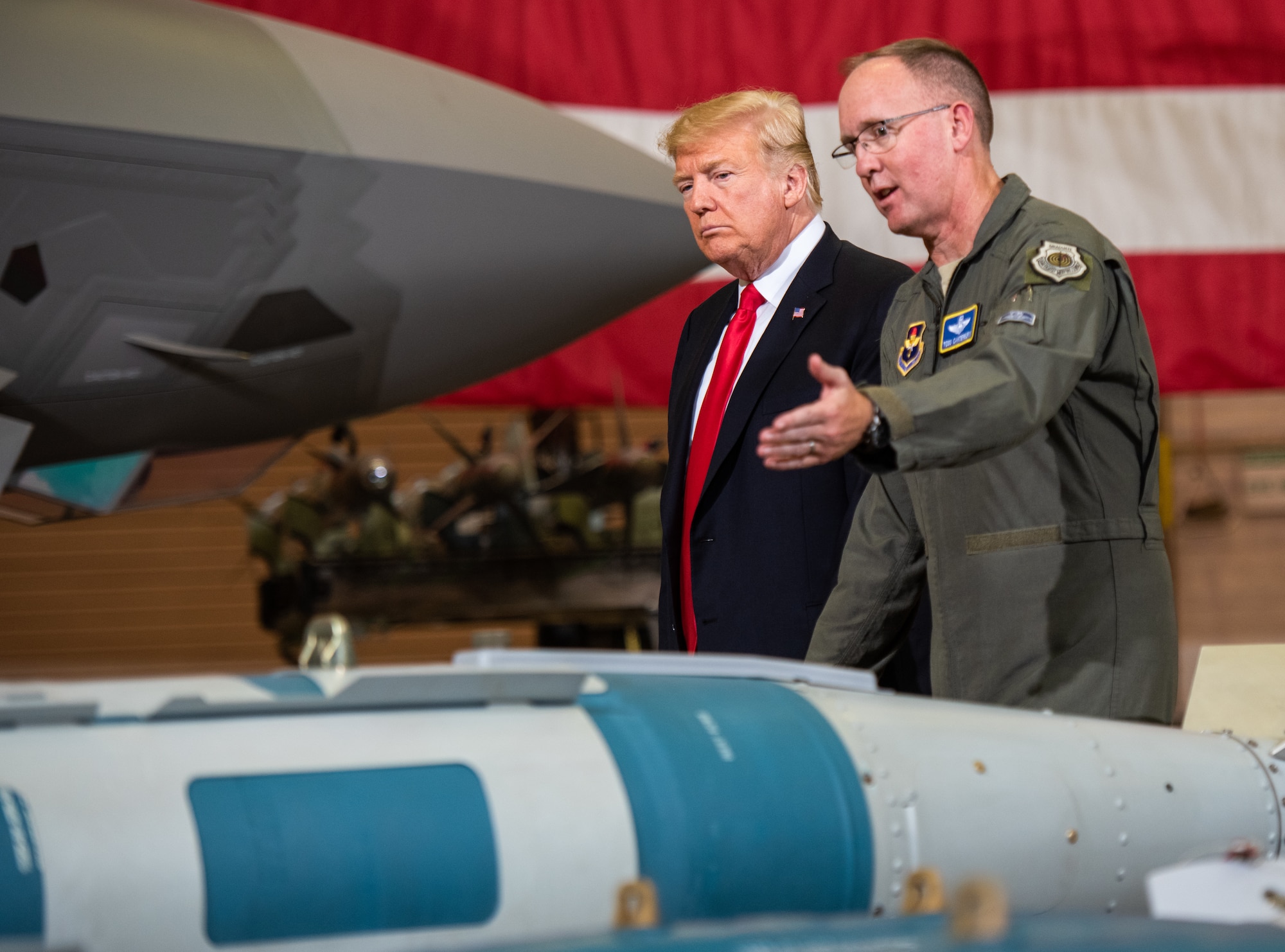 Brig Gen. Todd Canterbury, 56th Fighter Wing commander briefs President Donald J. Trump about the capabilities of the GBU-12 bomb during his visit to Luke Air Force Base, Ariz., Oct. 19, 2018. After touring a static display of the F-35A Lightning II and other military equipment, Trump met with cabinet members, congressmen, and defense industry leaders in a roundtable discussion on current defense issues including cybersecurity, stealth technology, and F-35 development. (U.S. Air Force photo by Senior Airman Alexander Cook)