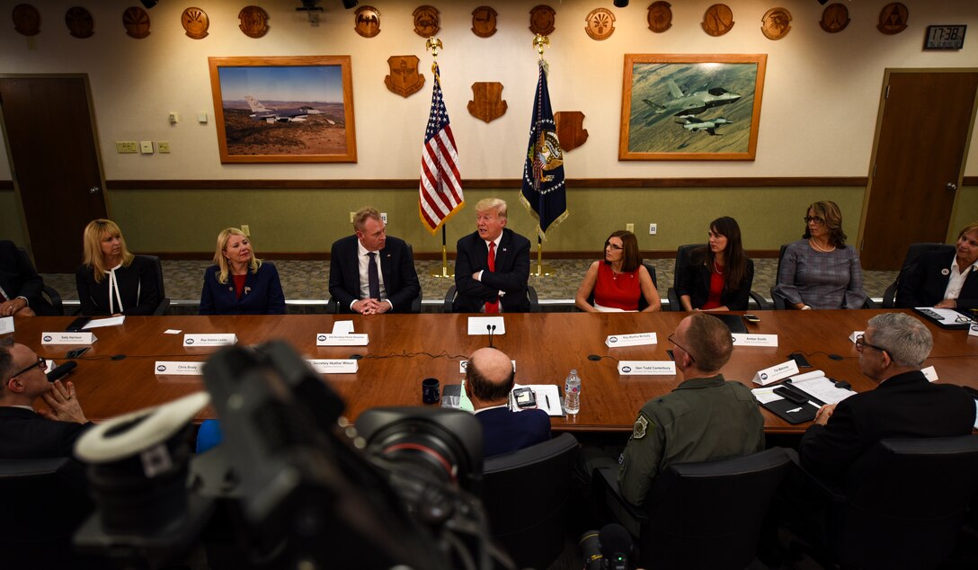President Donald J. Trump engages in a roundtable discussion with cabinet members, congressmen, and defense industry leaders Oct. 19, 2018, at Luke Air Force Base, Ariz. The discussion focused on a variety of topics including cybersecurity, foreign military sales, and technological advancement. (U.S. Air Force photo by Senior Airman Ridge Shan)