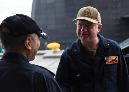 FLEET ACTIVITIES YOKOSUKA, Japan (Oct. 19, 2018) Rear Adm. Jimmy Pitts, Commander, Submarine Group 7, greets Cmdr. Takehiko Hirama, commanding officer of JS Seiryu (SS-509), prior to going underway aboard the Japanese submarine. The familiarity cruise is to reinforce the submarine group's commitment to the U.S.-Japan alliance.