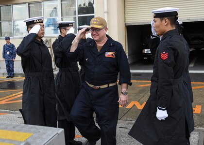 FLEET ACTIVITIES YOKOSUKA, Japan (Oct. 19, 2018) Rear Adm. Jimmy Pitts, Commander, Submarine Group 7, salutes Japan Maritime Self-Defense Force Sailors as he is whistled aboard JS Seiryu (SS-509), prior to going underway aboard the Japanese submarine. The familiarity cruise is to reinforce the submarine group's commitment to the U.S.-Japan alliance.