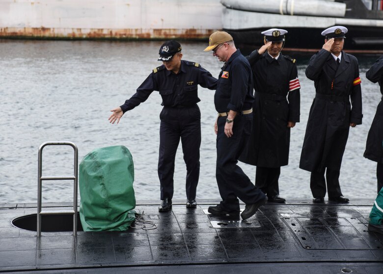 FLEET ACTIVITIES YOKOSUKA, Japan (Oct. 19, 2018) Rear Adm. Jimmy Pitts, Commander, Submarine Group 7, is welcomed aboard JS Seiryu (SS-509) by Cmdr. Takehiko Hirama, commanding officer of Seiryu, prior to going underway aboard the Japanese submarine. The familiarity cruise is to reinforce the submarine group's commitment to the U.S.-Japan alliance.