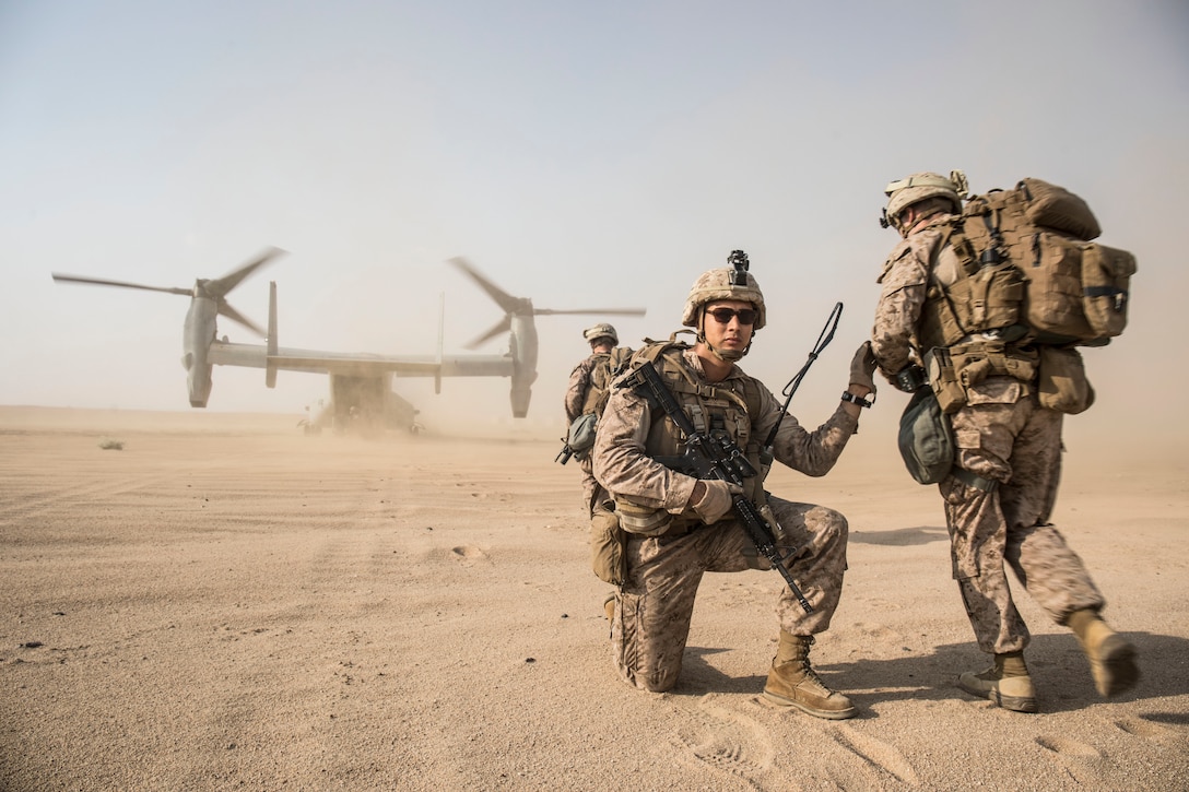 U.S. Marines with 3rd Battalion, 7th Marine Regiment, attached to Special Purpose Marine Air-Ground Task Force, Crisis Response-Central Command, assist a simulated casualty during a tactical recovery of aircraft personnel exercise Oct. 10, 2018. Marines with SPMAGTF-CR-CC regularly conduct crisis response training to enhance mission readiness.