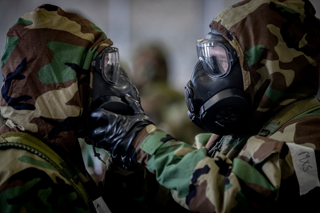 U.S. Air National Guard Airmen from the 108th Wing practice replacing filters on their M50 gas masks during an ability to survive and operate training class on Joint Base McGuire-Dix-Lakehurst, N.J., Oct. 20, 2018. The class included decontamination procedures, self aid and buddy care, and proper wear of the M50 gas mask.