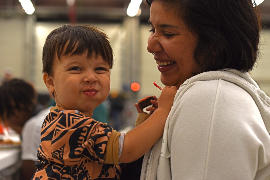 A Team Mildenhall child smiles during a Hearts Apart event Oct. 18, 2018, on RAF Mildenhall, England. The 100th Civil Engineering Squadron hosted the monthly event, which helps brings Team Mildenhall families of deployed Airmen closer during times of separation. (U.S. Air Force photo by Airman 1st Class Brandon Esau)