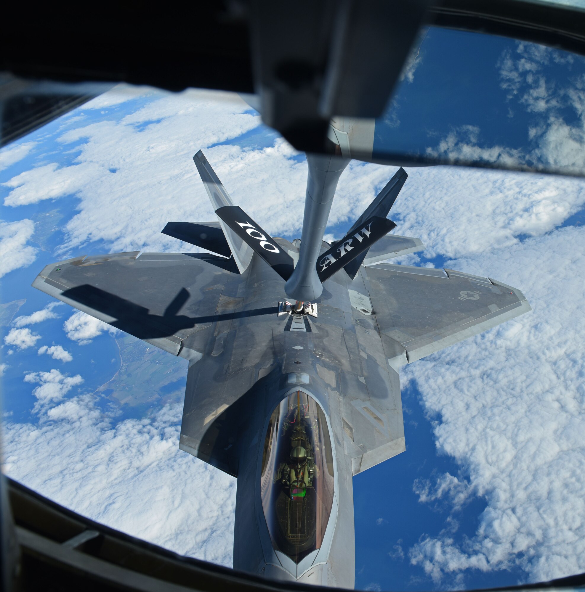 A U.S. Air Force F-22 Raptor receives fuel from a U.S. Air Force KC-135 Stratotanker during aerial refueling training off the coast of Finland, Oct. 19 2018. The Raptors deployed from the 27th Fighter Squadron, 1st Fighter Wing, Joint Base Langley-Eustis, Va., and arrived in Europe Oct. 5. (U.S. Air Force photo by Senior Airman Luke Milano)