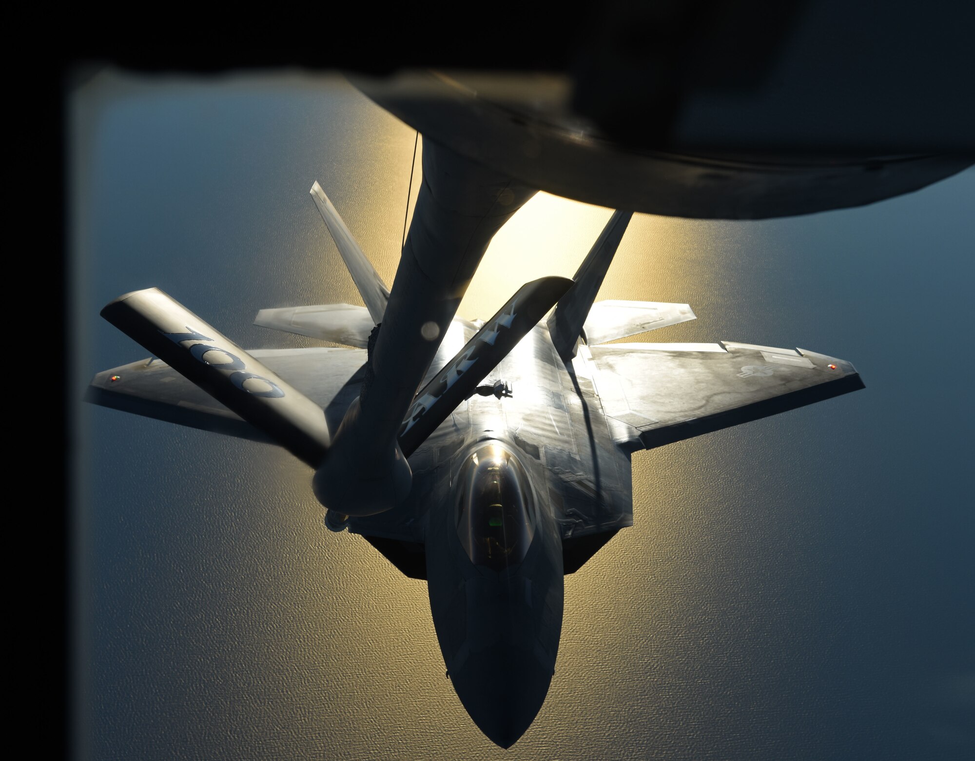 A U.S. Air Force F-22 Raptor flies behind a U.S. Air Force KC-135 Stratotanker during aerial refueling training off the coast of Finland, Oct 19, 2018. The Raptors deployed from the 27th Fighter Squadron, Joint Base Langley-Eustis, Va. and arrived in Europe Oct. 5. (U.S. Air Force photo by Senior Airman Luke Milano)