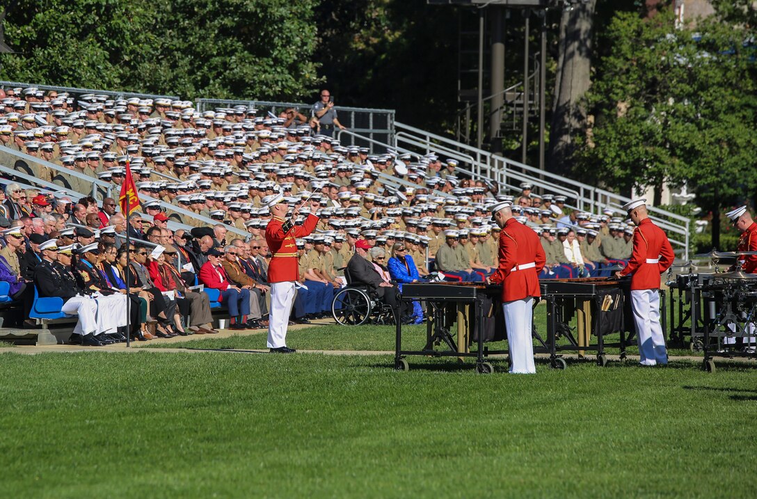 Captain James D. Foley, commanding officer, “The Commandant’s Own” U.S. Marine Drum & Bugle Corps, conducts the D&B during a parade for retired U.S. Marine Corps Sgt. Maj. John L. Canley, the 298th Marine Medal of Honor recipient at Marine Barracks Washington D.C., Oct. 19, 2017. It is tradition for the Barracks to host a parade for Marines who are awarded the Medal of Honor, our nation’s highest and most prestigious personal military decoration. (U.S. Marine Corps photo by Sgt. Robert Knapp/Released)