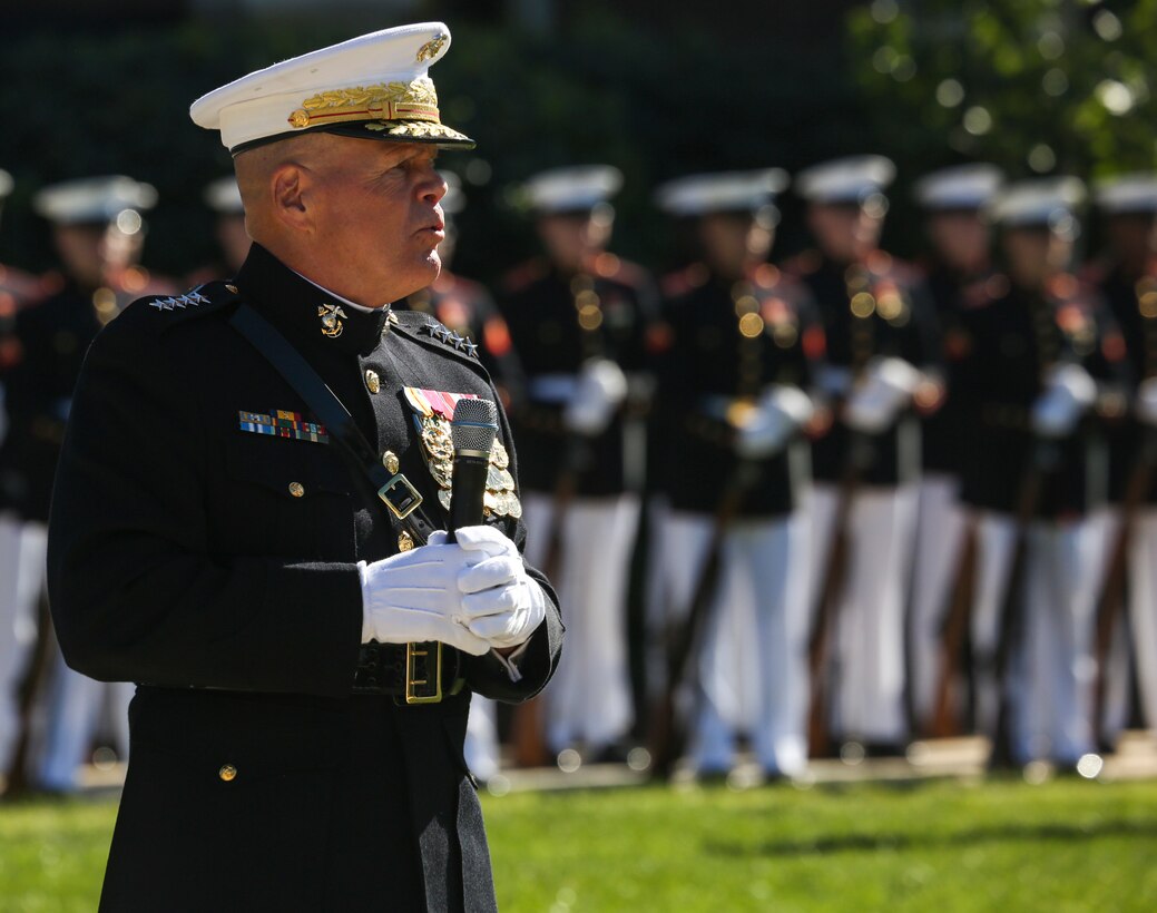 Commandant of the Marine Corps, Gen. Robert B. Neller, speaks to guests attending a parade for retired U.S. Marine Corps Sgt. Maj. John L. Canley, the 298th Marine Medal of Honor recipient at Marine Barracks Washington D.C., Oct. 19, 2017. It is tradition for the Barracks to host a parade for Marines who are awarded the Medal of Honor, our nation’s highest and most prestigious personal military decoration. (U.S. Marine Corps photo by Sgt. Robert Knapp/Released)