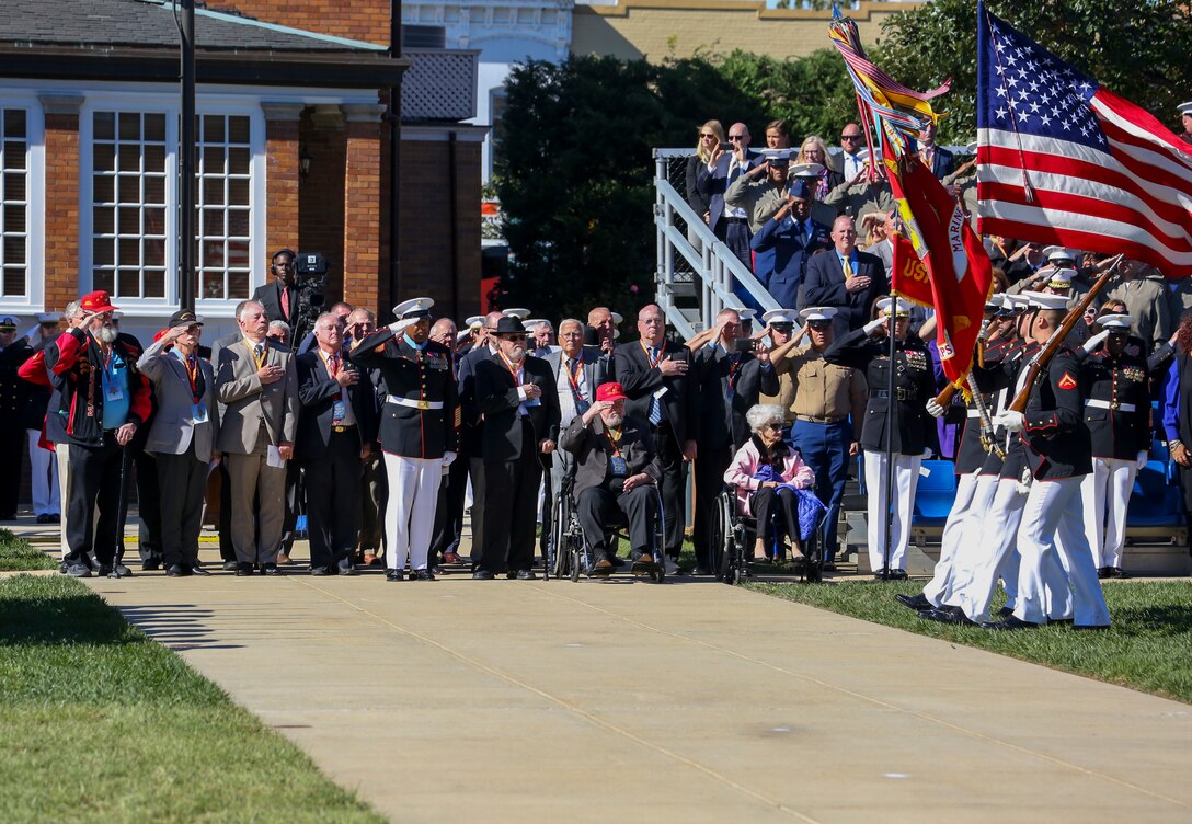 Retired U.S. Marines with 1st Battalion, 1st Marines stand on Center Walk for pass in review during a parade for retired U.S. Marine Corps Sgt. Maj. John L. Canley, the 298th Marine Medal of Honor recipient at Marines Barracks Washington D.C., Oct. 19, 2017.