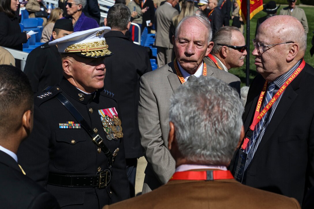 Commandant of the Marine Corps, Gen. Robert B. Neller, speaks to retired U.S. Marines with 1st Battalion, 1st Marines at the conclusion of a parade for retired U.S. Marine Corps Sgt. Maj. John L. Canley, the 298th Marine Medal of Honor recipient at Marines Barracks Washington D.C., Oct. 19, 2017.