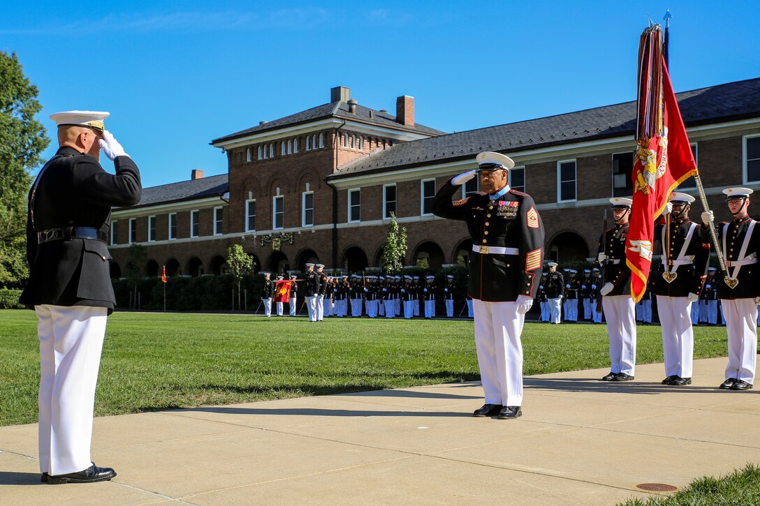 Commandant of the Marine Corps, Gen. Robert B. Neller, left, salutes retired U.S. Marine Corps Sgt. Maj. John L. Canley, the 298th Marine Medal of Honor recipient, during a parade for Canley at Marine Barracks Washington D.C., Oct. 19, 2017. It is tradition for the Barracks to host a parade for Marines who are awarded the Medal of Honor, our nation’s highest and most prestigious personal military decoration. (U.S. Marine Corps photo by Cpl. Damon Mclean/Released)