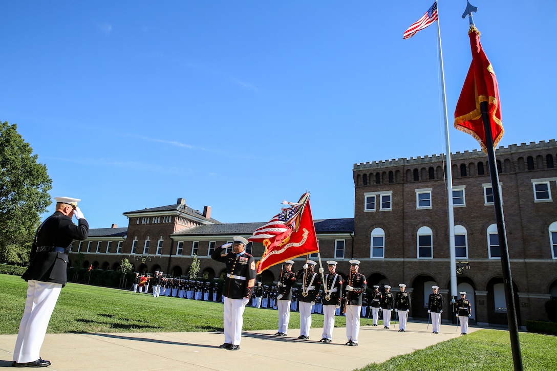 Commandant of the Marine Corps, Gen. Robert B. Neller, left, salutes retired U.S. Marine Corps Sgt. Maj. John L. Canley, the 298th Marine Medal of Honor recipient, during a parade for Canley at Marine Barracks Washington D.C., Oct. 19, 2017. It is tradition for the Barracks to host a parade for Marines who are awarded the Medal of Honor, our nation’s highest and most prestigious personal military decoration. (U.S. Marine Corps photo by Cpl. Damon Mclean/Released)