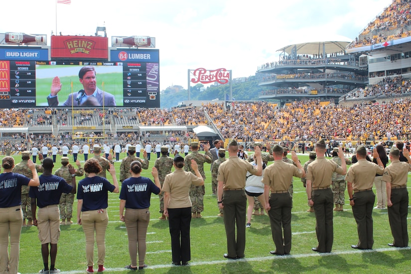 SECARMY gives the Oath at mass enlistment ceremony at Steelers game