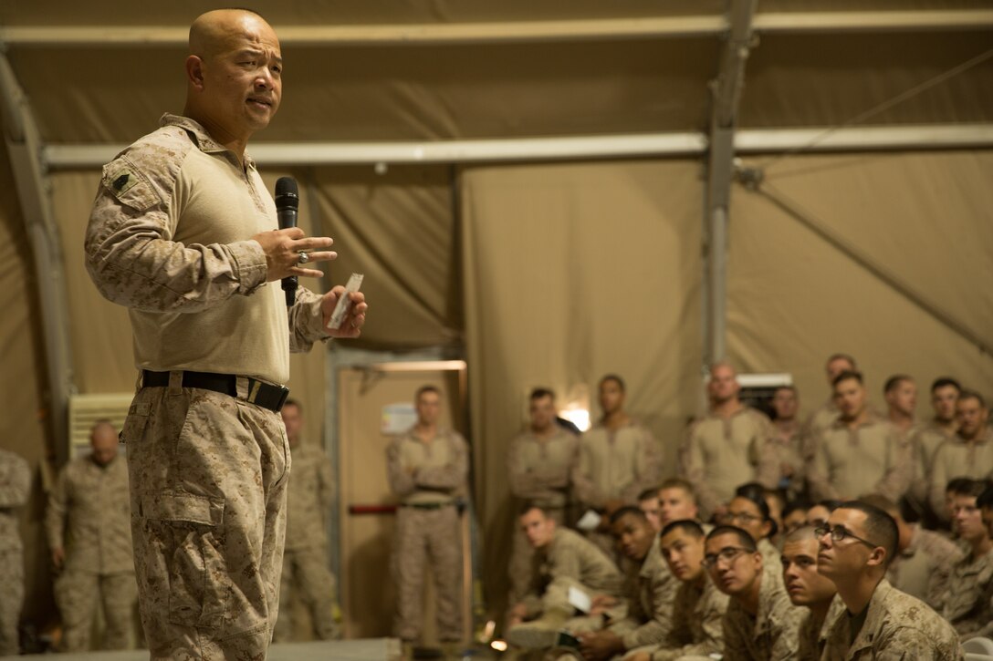 UNDISCLOSED LOCATION, SOUTHWEST ASIA - U.S. Marine Corps Sgt. Maj. Chuong Ngyuen, the sergeant major of Special Purpose Marine Air-Ground Task Force, Crisis Response-Central Command, speaks to Marines and Sailors during a town hall meeting Oct. 19, 2018. During the town hall, the SPMAGTF-CR-CC Commanding Officer and Sergeant Major briefed Marines on operations in the region. (U.S. Marine Corps photo by Cpl. Teagan Fredericks)