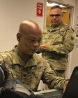 U.S. Army Lt. Col. Bryant Venable, JTF-CS CBRN planner provides a toxic industrial chemical/toxic industrial material analysis for U.S. Army Col Lisandro Murphy, a Chief Emergency Preparedness Liaison Officer, Defense Coordinating Element, FEMA Region II. (Official DoD photo by Navy Cmdr. Jody Daniel/released)