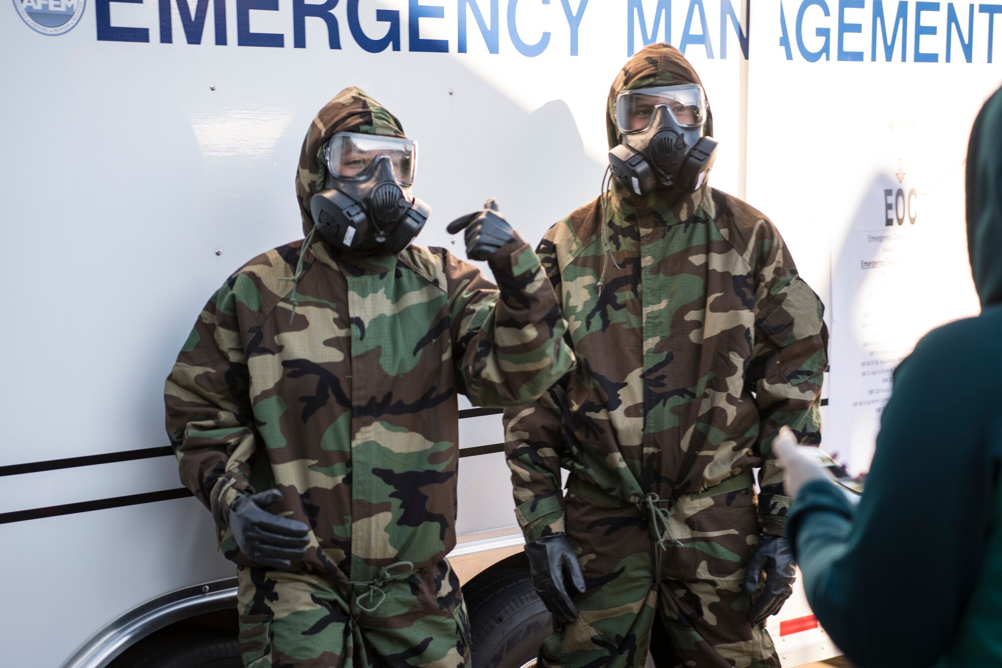 Students from Indiana University Kokomo try on mission oriented protective posture [MOPP] gear at Grissom Air Reserve Base, Ind., Oct. 17, 2018. Students of IUK's criminal justice program were given a tour of Grissom facilities to learn about federal emergency management. (U.S. Air Force photo / Senior Airman Harrison Withrow)