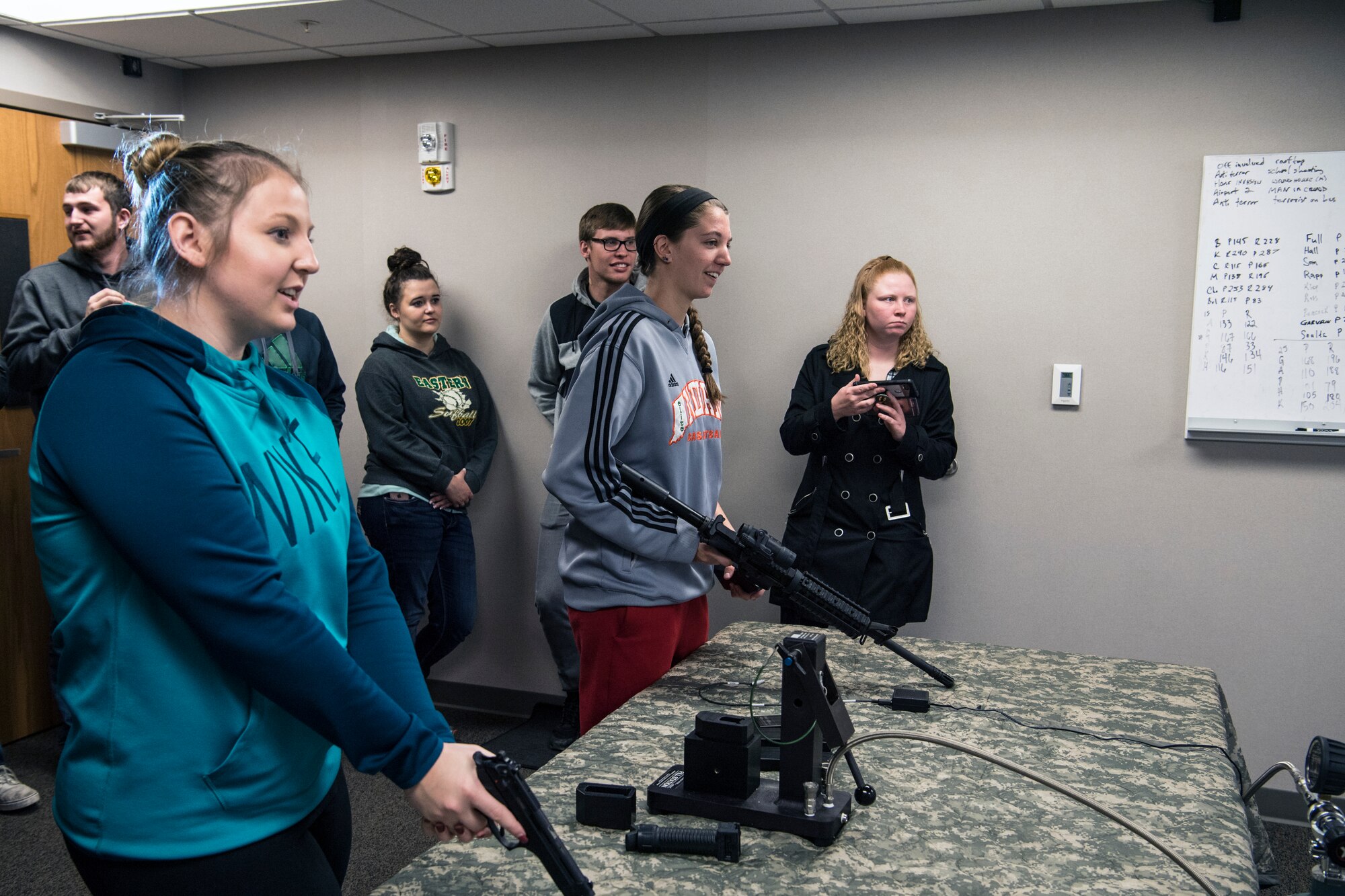 Students from Indiana University Kokomo are given a demonstration of 434th Security Forces Squadron's firearm training simulator at Grissom Air Reserve Base, Ind., Oct. 17, 2018. Students of IUK's criminal justice program were given a tour of Grissom facilities to learn about federal emergency management. (U.S. Air Force photo / Senior Airman Harrison Withrow)