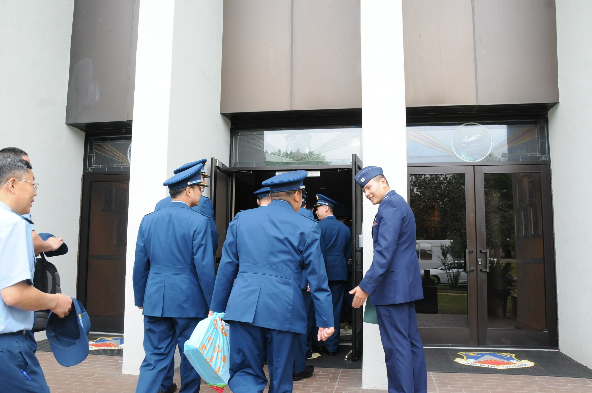 Midday and middle of the week, a wave of blue and navy uniforms washed over the inner circle of Air War College.