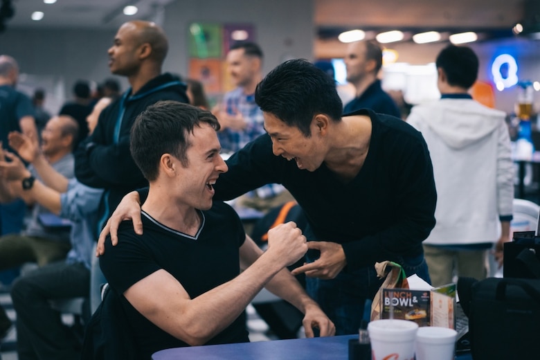 Japan Air Self-Defense Force Staff Sgt. Masaya Ito and U.S. Air Force Staff Sgt. Zachary Kelly, participants of the 16th Annual NCO Exchange Program, share a laugh during the NCOEP bowling mixer at Yokota Air Base, Japan, March 23, 2016. The mixer was one of many opportunities for JASDF to become more immersed and develop deeper relationships with their Yokota partners. (U.S. Air Force photo by Airman 1st Class Delano Scott/Released)