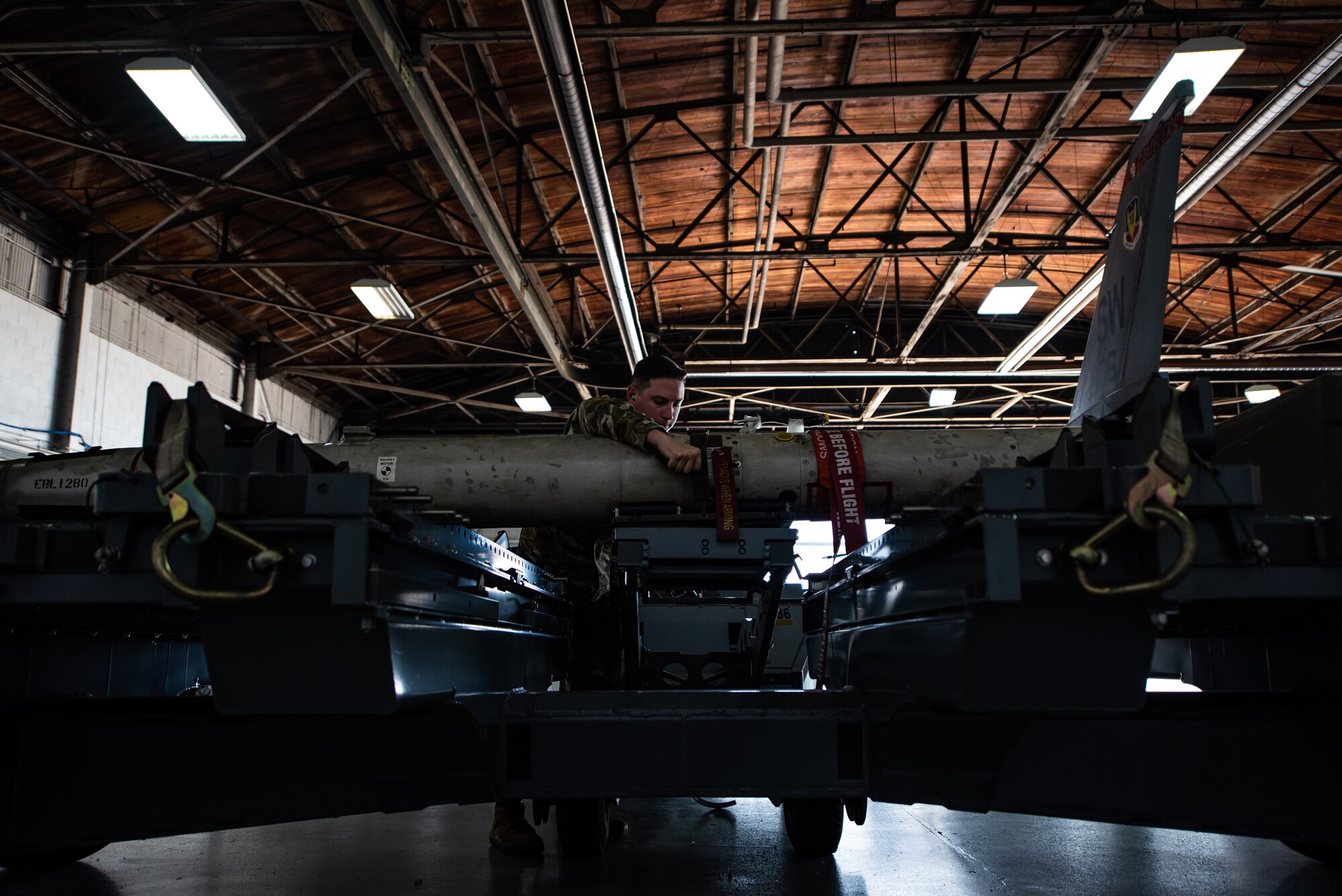 U.S. Air Force Staff Sgt. Justin Tankersley, 20th Maintenance Group weapons lead crew chief, prepares a munition to be loaded onto an F-16 Fighting Falcon at Shaw Air Force Base, S.C., Oct. 16, 2018.