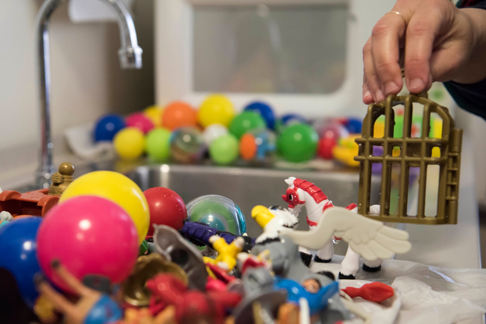 Soha Dobbins, a Children’s Waiting Room child specialist, washes toys used in the Children’s Waiting Room at Joint Base Elmendorf-Richardson, Alaska, Oct. 18, 2018. The program offers parents with hospital appointments a safe, no-cost, temporary child care solution for children ages 6 weeks to 12 years old.