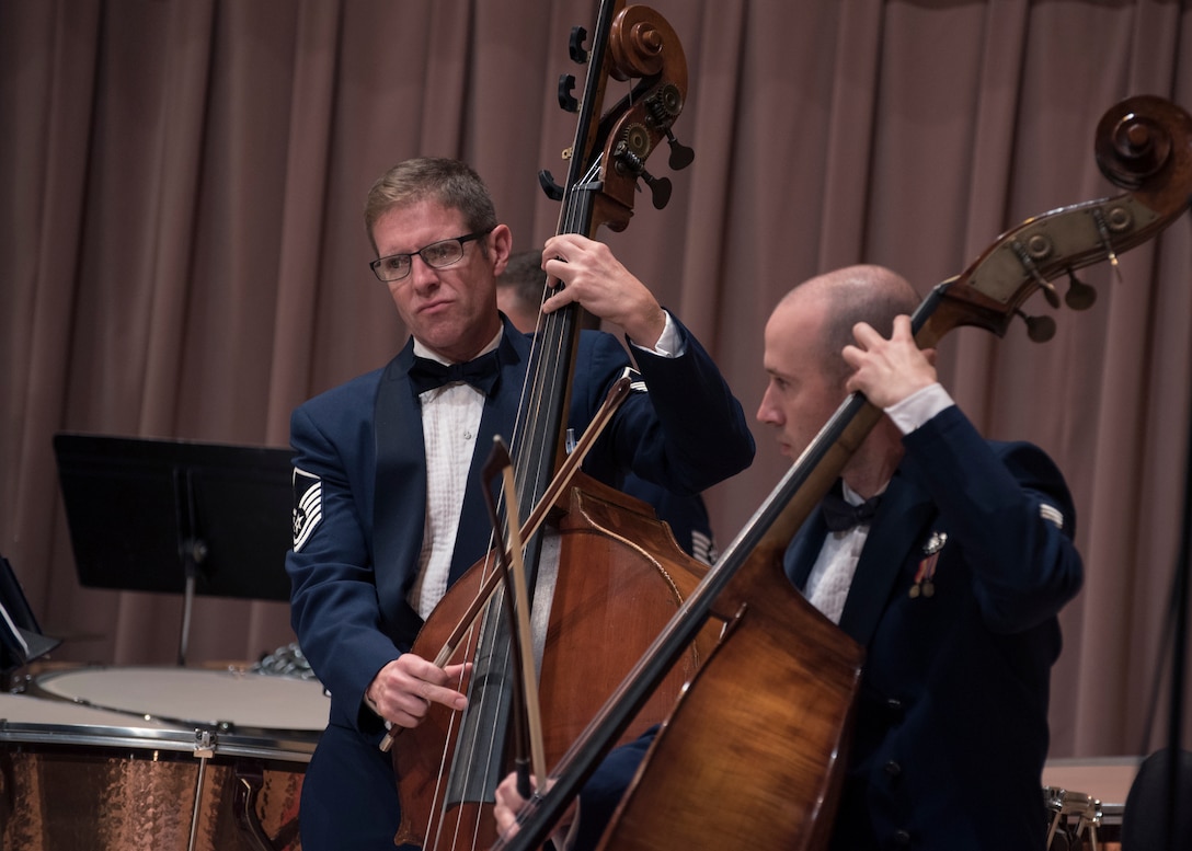 Master Sgt. Matthew Murray, left, and Tech. Sgt. Jonathan Davies, right, U.S. Air Force Band musicians, play the string bass at the V. Sue Cleveland High Concert Hall in Rio Rancho, N.M., Oct. 17, 2018. The band performed in five locations across N. M. and Texas and will continue to an additional seven cities, with a final concert scheduled for Oct. 27 in Allen, Texas. (U.S. Air Force photo by Senior Airman Abby L. Richardson)