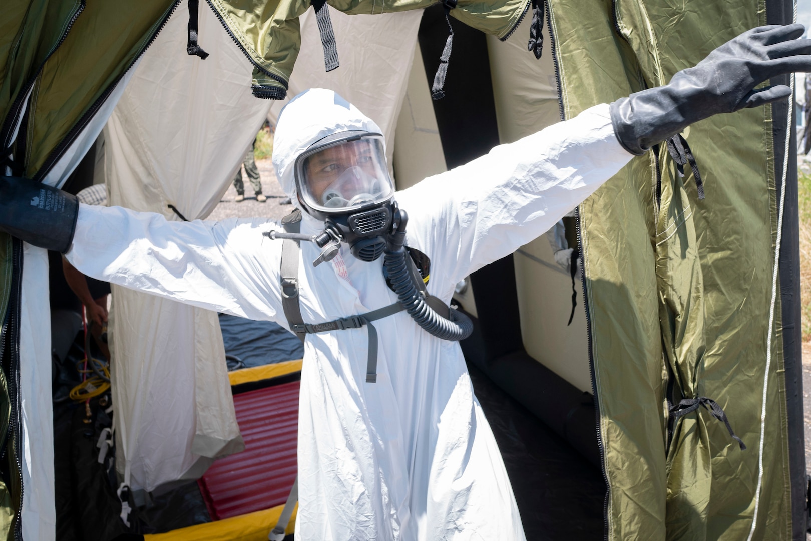 Staff Sgt. James Almero, 154th Medical Group Detachment 1, search extraction rescue operations technician, exits a decontamination tent