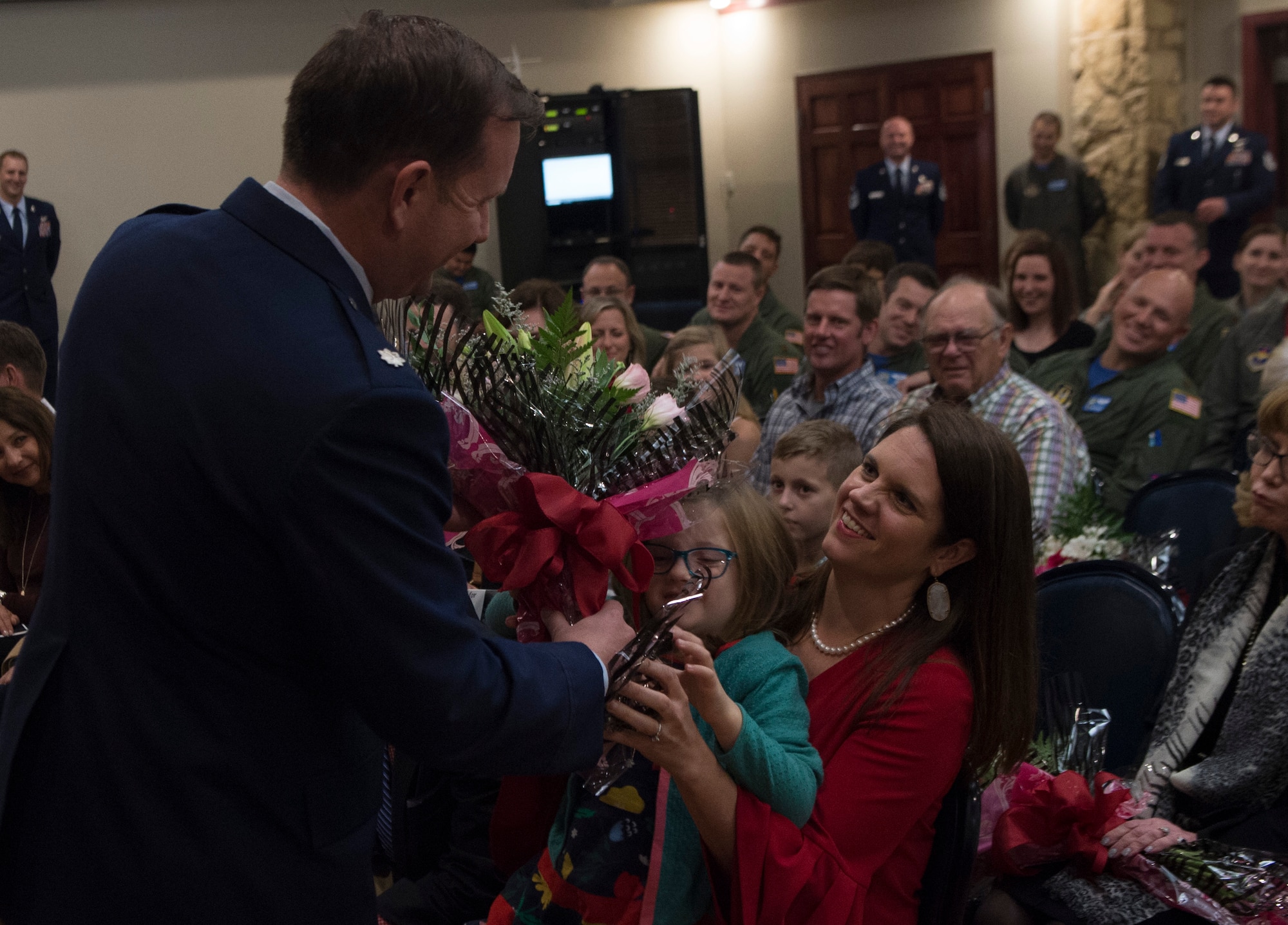 A man giving a woman flowers