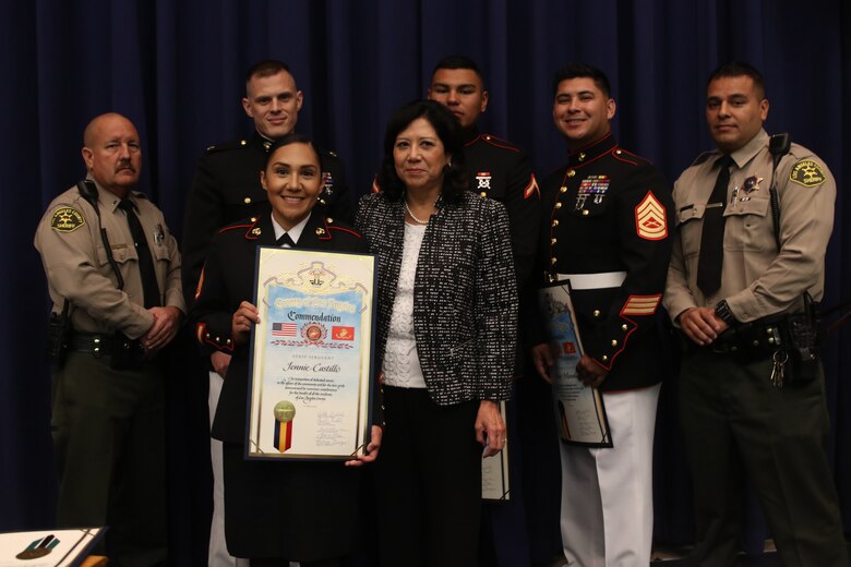 Staff Sgt. Jennie Castillo poses for a photo with members of the Board of Supervisors from the County of Los Angeles and members of the Los Angeles Police Department at the Kenneth Hahn Hall of Administration, CA, Oct. 16, 2018. Castillo is a native of Santa Ana, CA. Castillo was awarded the County of Los Angeles Commendation by the Board of Supervisors for applying first aid to a high school student, saving his life