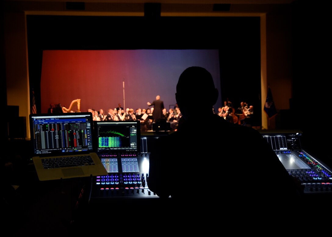 Master Sgt. Loren Zimmer, U.S. Air Force Band audio engineer, operates the front of house console during an Air Force Band performance at Los Alamos High School in Los Alamos, N.M., Oct. 16, 2018. The band performed in locations across N.M. and Texas to inspire and engage the local communities. (U.S. Air Force photo by Senior Airman Abby L. Richardson)